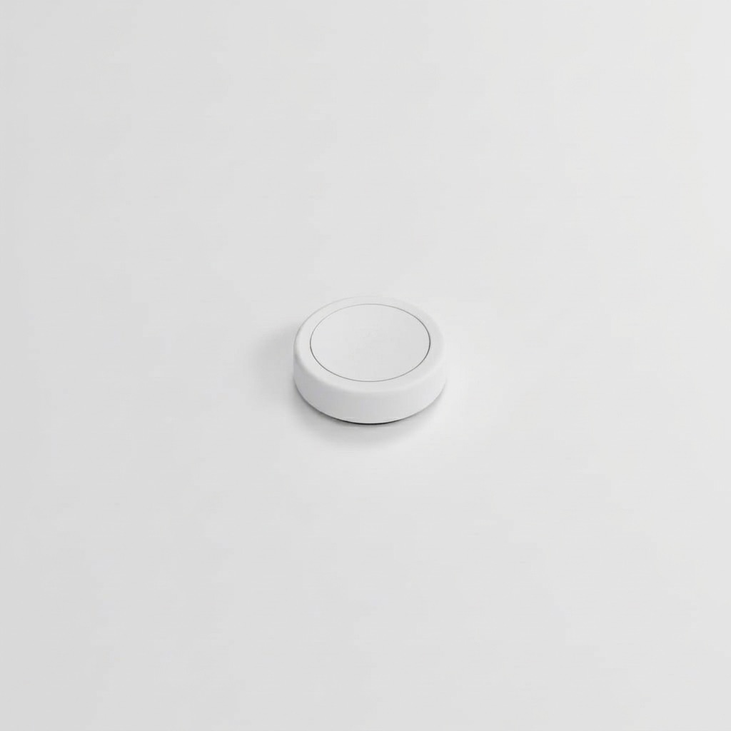 A single white Flic Smart Button photographed on a clean studio surface.