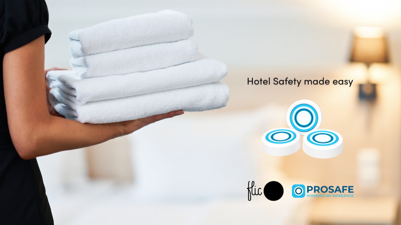 A hotel staff member with a stack of towels — the ProSafe Hotel Safety platform in context.